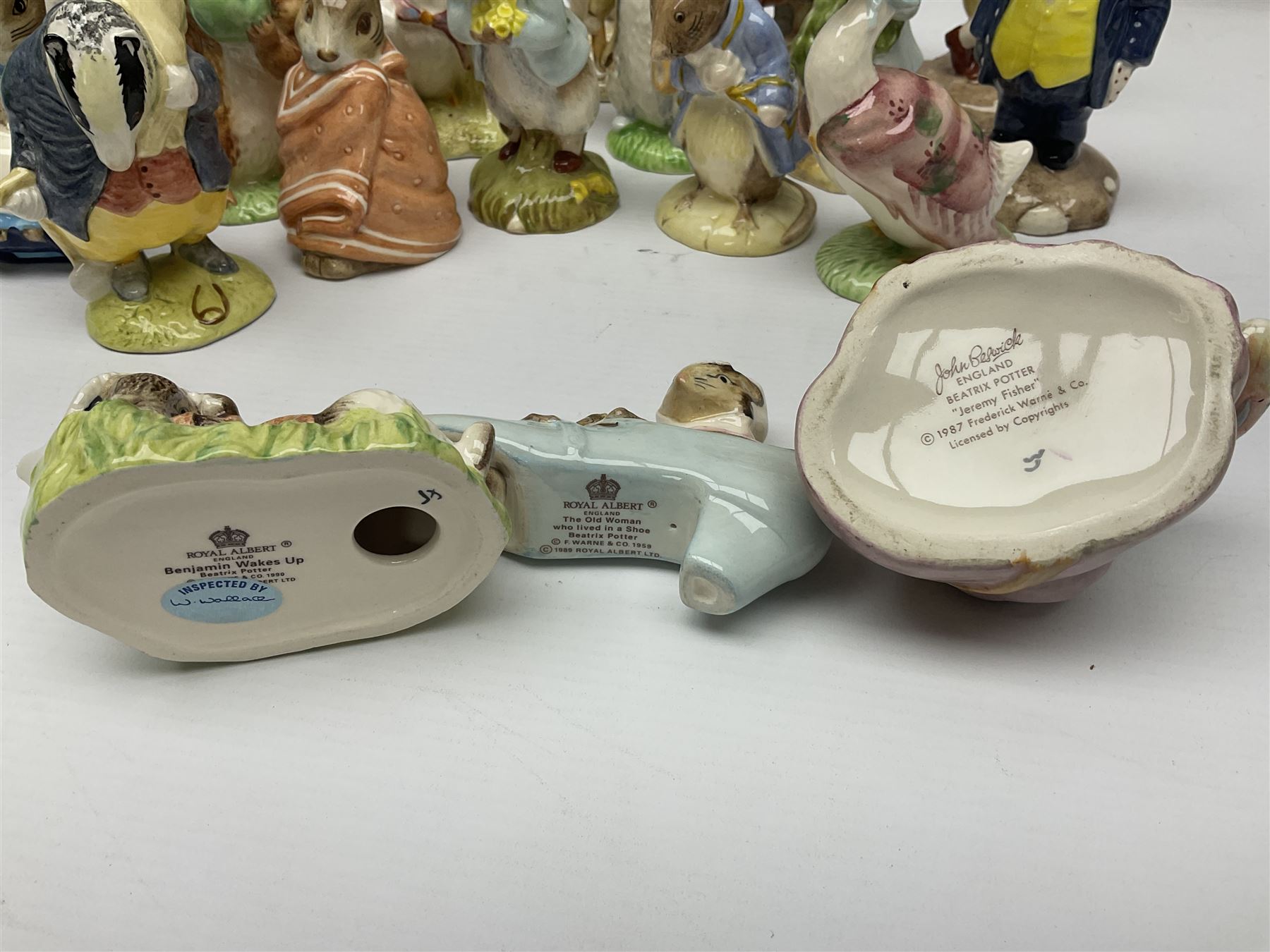Sixteen Royal Albert Beatrix Potter figures, including Poorly Peter Rabbit, Jemima Puddle Duck and Squirrel Nutkin etc, all boxed together with a Beswick Beatrix Potter Jeremy Fisher miniature jug and four Beswick Wind in the Willows figures 