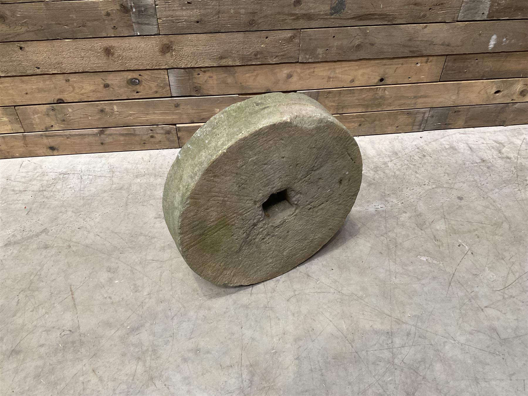 19th century circular stone mill wheel,