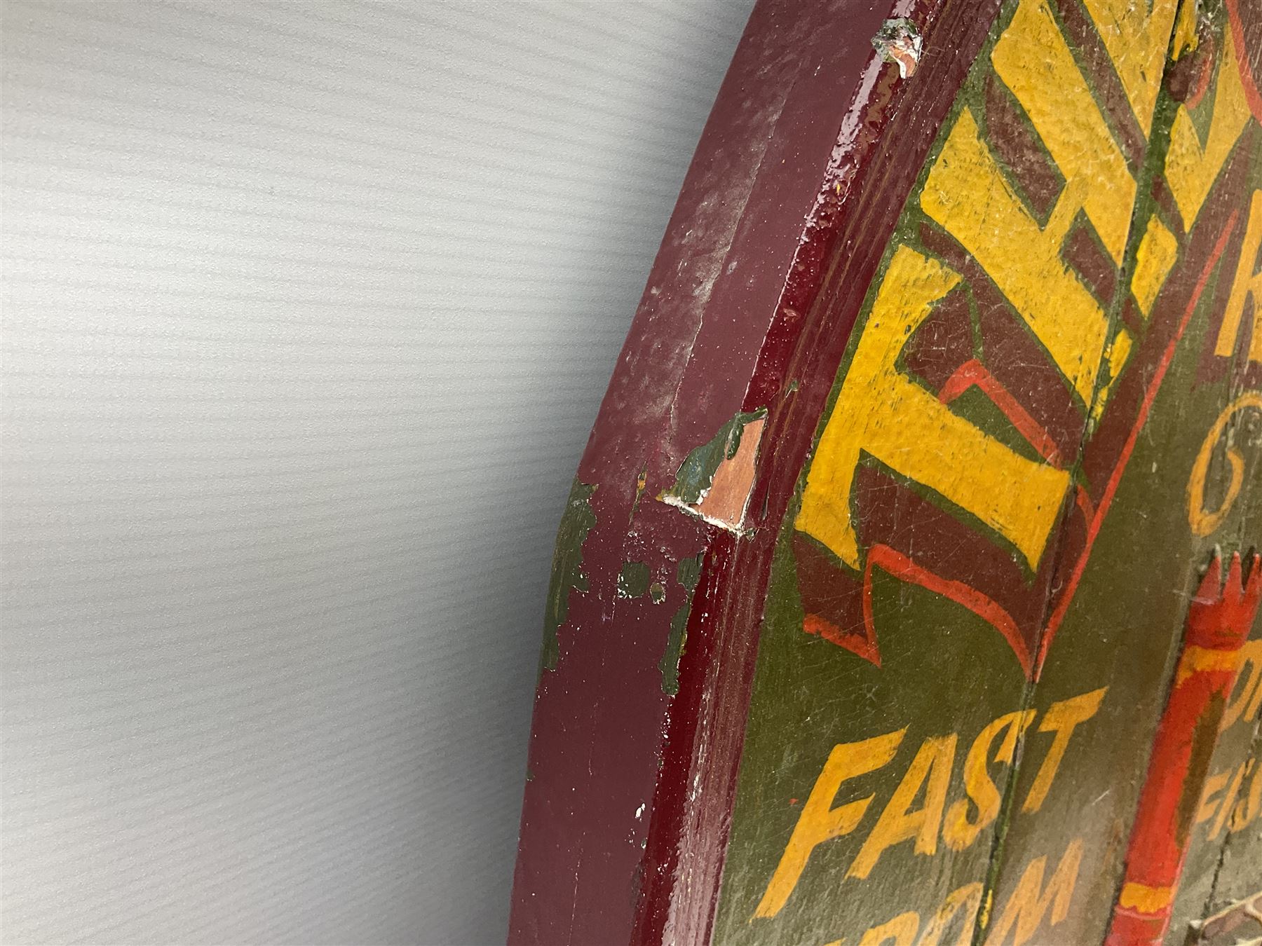 `The Grimsby-York Railroad Co.` painted wooden railway advertising sign 20th century, of planked construction with arched top and moulded border, decorated with an applied wood and metal image of an early steam locomotive in relief, the surrounding wording reading `The Grimsby-York Railroad Co., Fast Dispatch by Rail from Fish Curing Houses of Grimsby & Hull, Est. 1873, Daily Connections to Billingsgate`, 89 x 71cm
