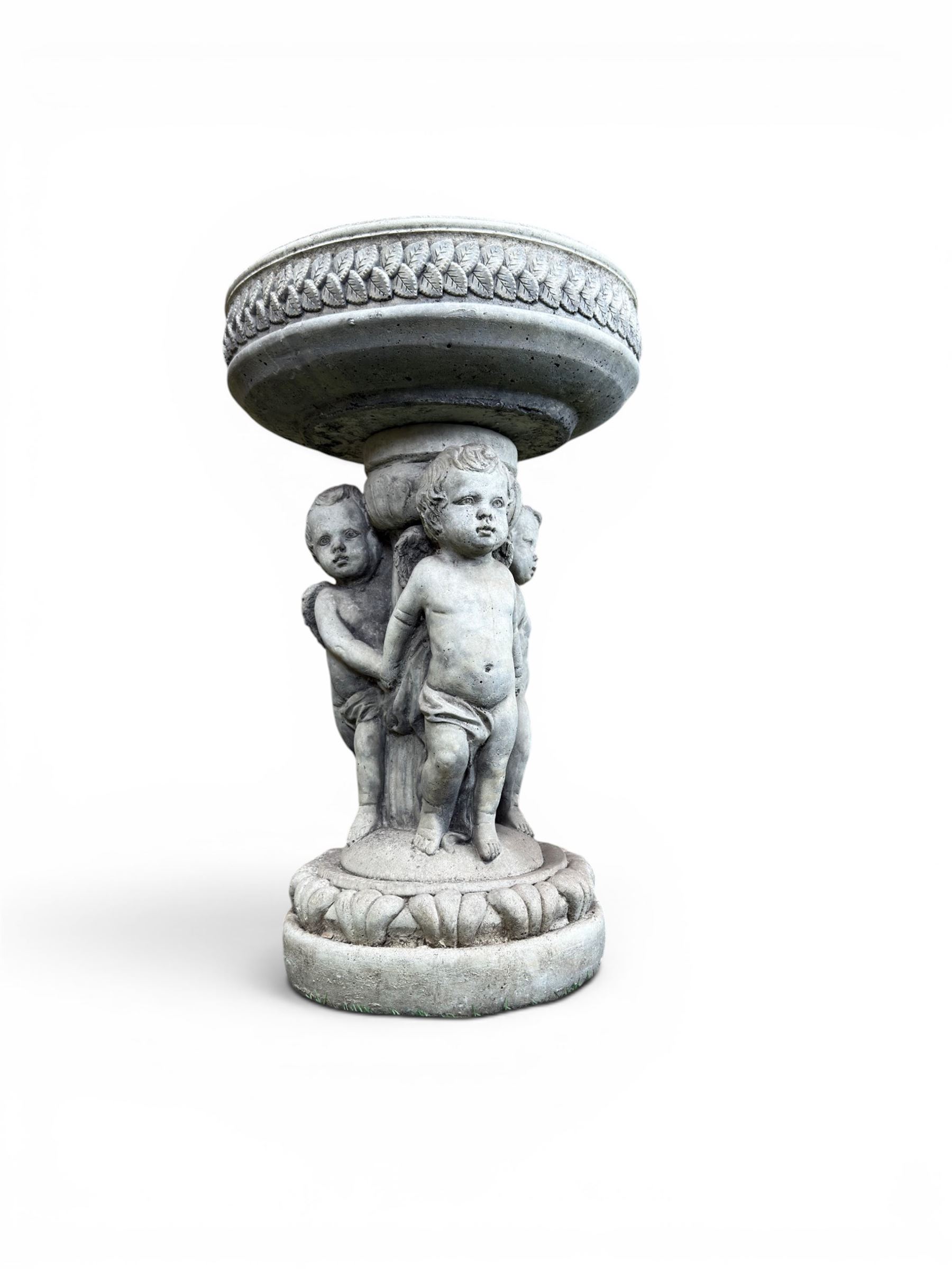 Cast stone cherub bird bath, circular removable top raised on three cherubs with ornate detailing