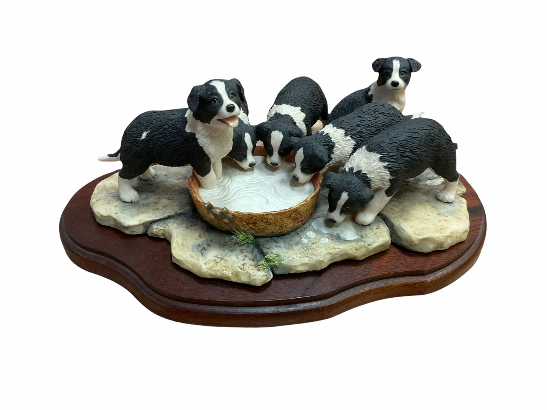 Border fine arts figures, Pick of the litter, model no JH30, by Ray Ayres L26cm, Tug of war, model no JH61, by D Walton H11.5cm and Robin with chicks in boot, model no RB45, by by Ray Ayres H11cm.  