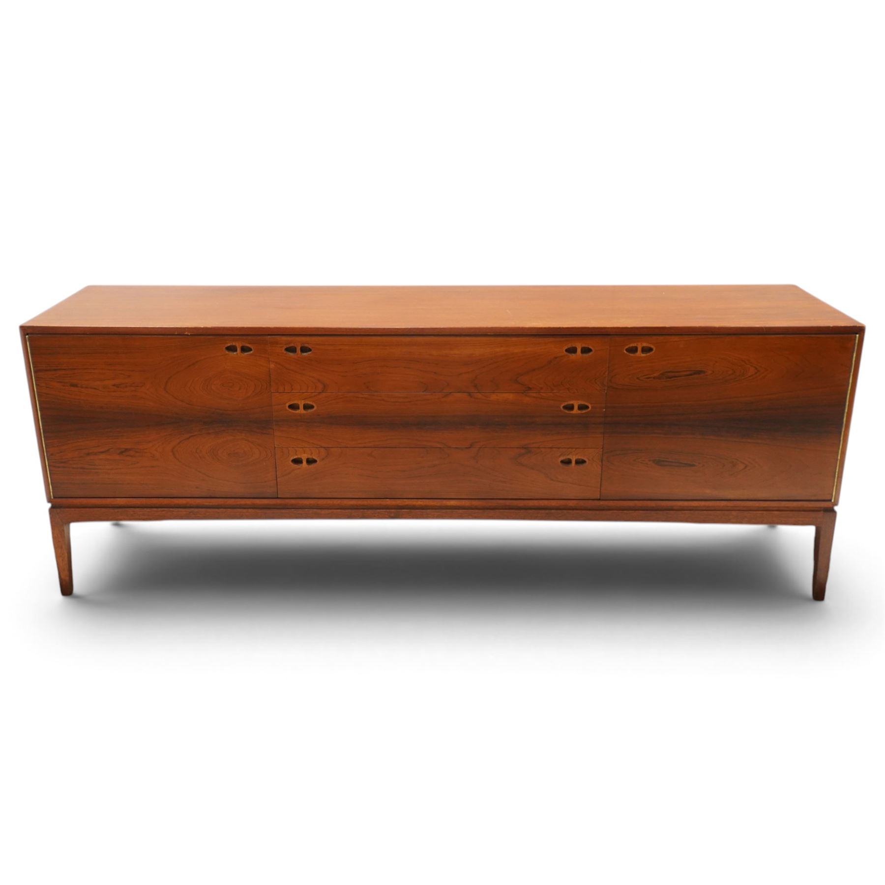 Robert Heritage (1927-2008) for Archie Shine - Large rosewood sideboard, with a central bank of three drawers flanked by a cupboard either side, raised on square tapering supports