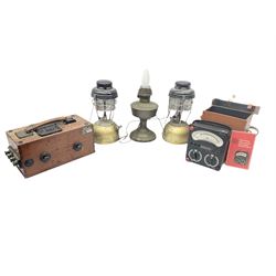 Megger Evershed's Testing Set in mahogany case, Avometer, model 8 Mk 5, in leather carry case, together with a pair of oil lamps and a oil lamp converted to electric. 