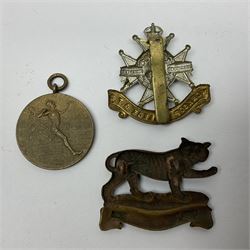 WW1 pair of medals awarded to 151761 Gnr. S. Loten R.A. with ribbons; four WW2 medals with ribbons; and small quantity of cap badges, medallions etc