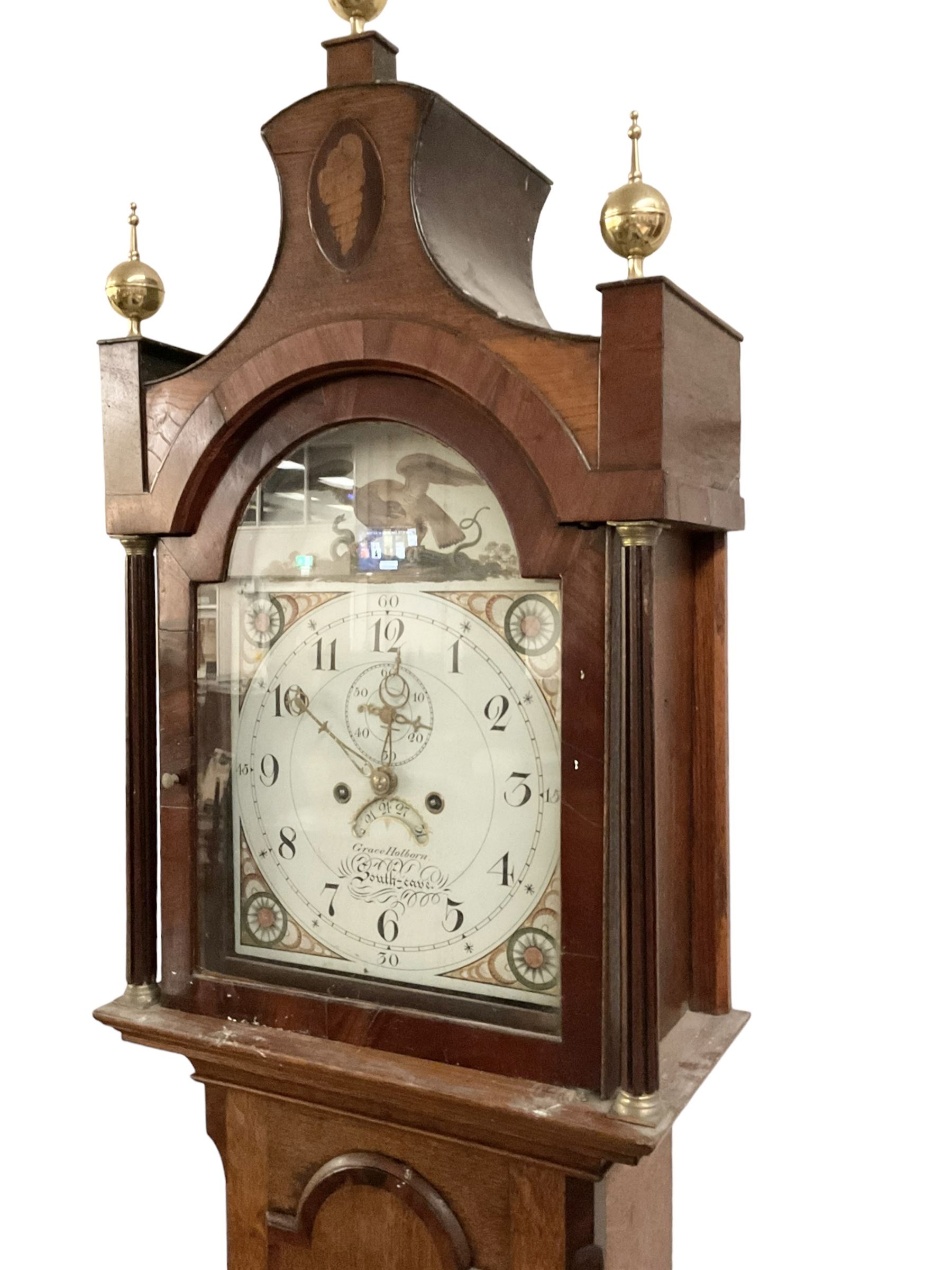 Grace Holborn of South Cave (Nr Hull Yorks.) -  Oak and mahogany 8-day longcase clock, c1820, with a pagoda topped pediment with inlay and three ball and spire finials, break arch painted dial flanked by two reeded pilasters with brass capitals, trunk with canted corners and a full length break arch door, square plinth on bracket feet, dial with upright Arabic numerals and geometric painted spandrels, depiction of an eagle and a snake to the arch,  with a seconds dial and calendar aperture, brass hands and seconds pointer, rack striking recoil anchor weight driven movement, striking the hours on a bell. With weights and pendulum.
Grace Holborn was most probably the widow of Charles William Holborn who was a clockmaker in South Cave 1759-1811.