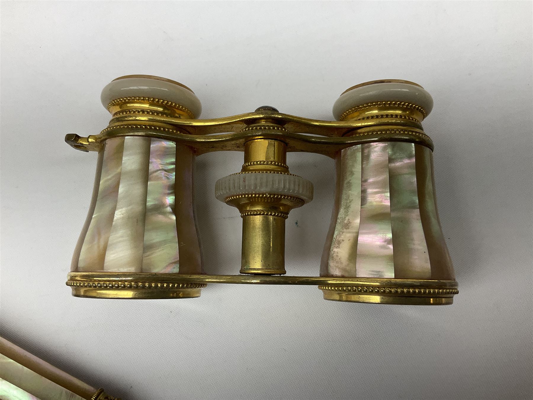 Pair of Victorian mother of pearl and gilt brass opera glasses, with