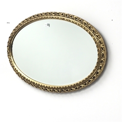  Oval gilt framed bevel edge mirror, W72cm, H45cm  