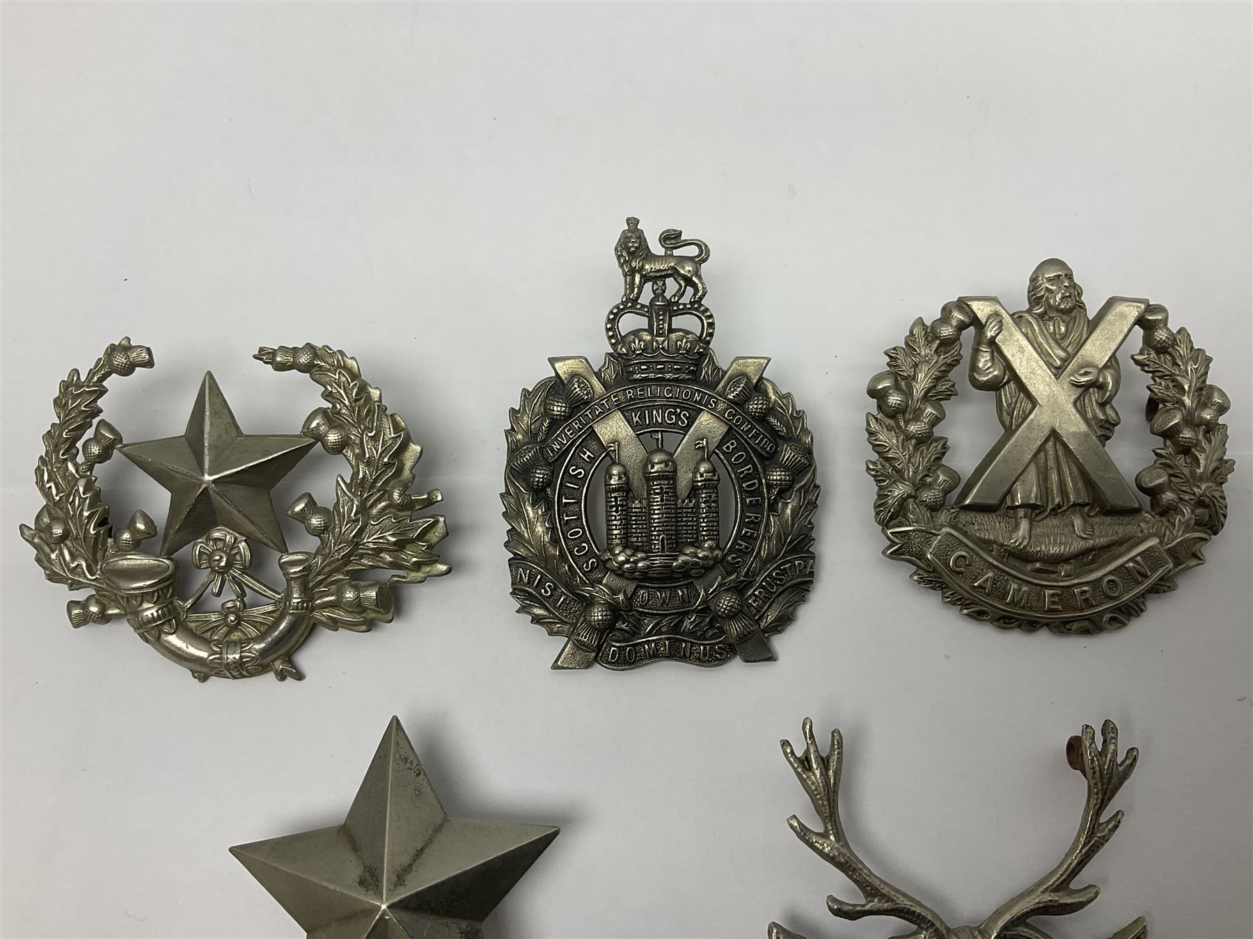 Thirteen Scottish metal Glengarry badges including Black Watch, Highland Regiment, Cameronians, Argyll & Sutherland, Seaforth Highlanders, Kings Scottish Own Borderers etc