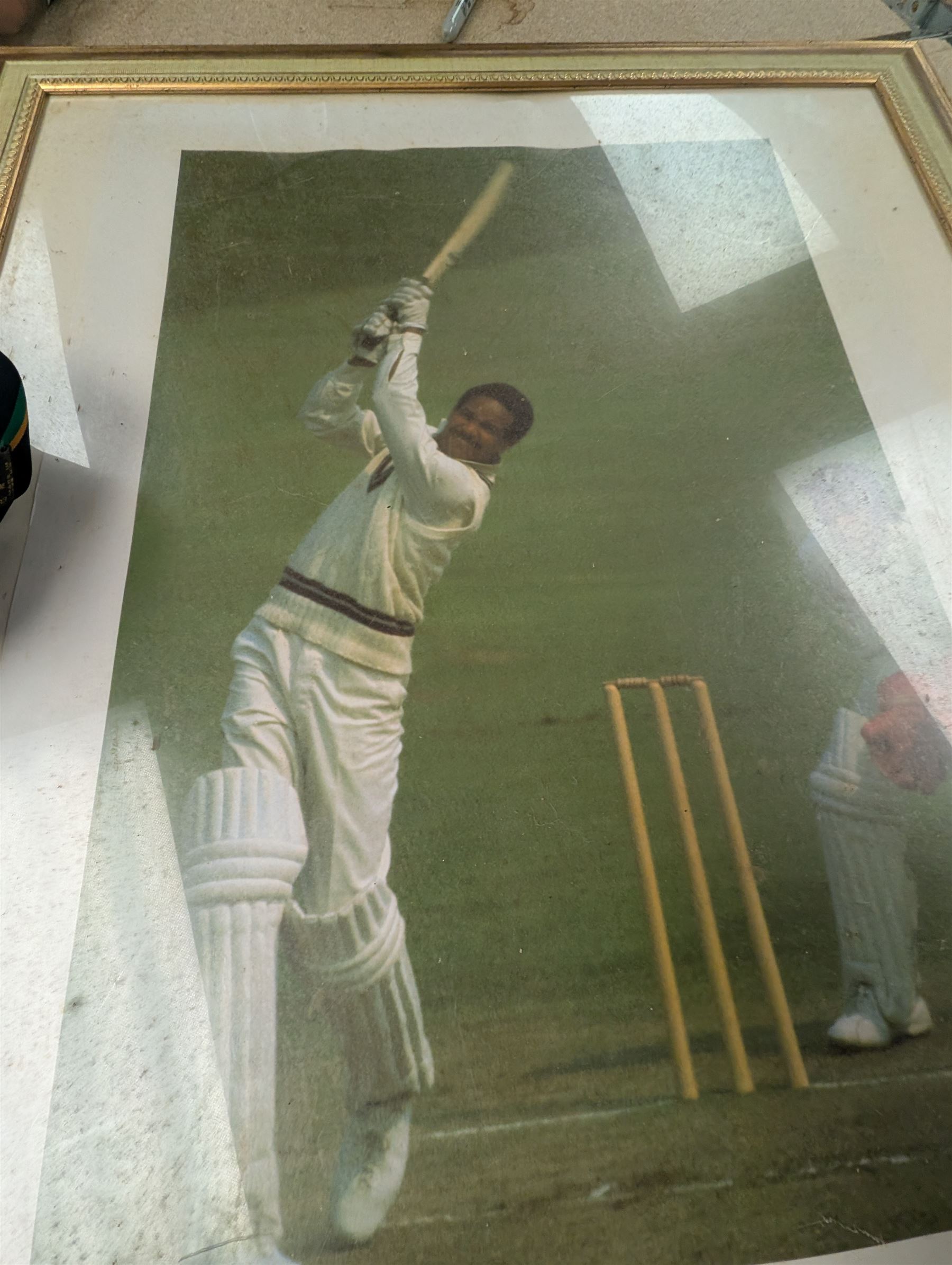 Collection of signed International cricket memorabilia, mostly relating to West Indies, including Curtly Ambrose and Brian Lara prints, Shane Warne and Glen McGrath last test souvenirs, signed Zimbabwe 2003 tour cricket bat, etc