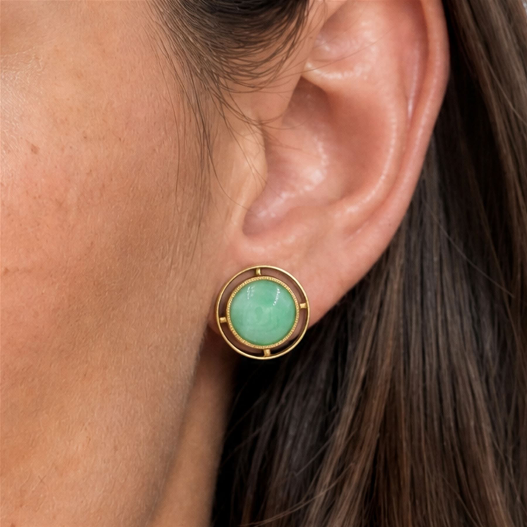 Pair of 21ct gold jadeite earrings, each screw back stud set with a circular cabochon jadeite