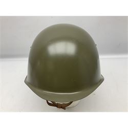 Two 1960s East Block Soviet style helmets - Czechoslovakian and Russian; both with liners (2)