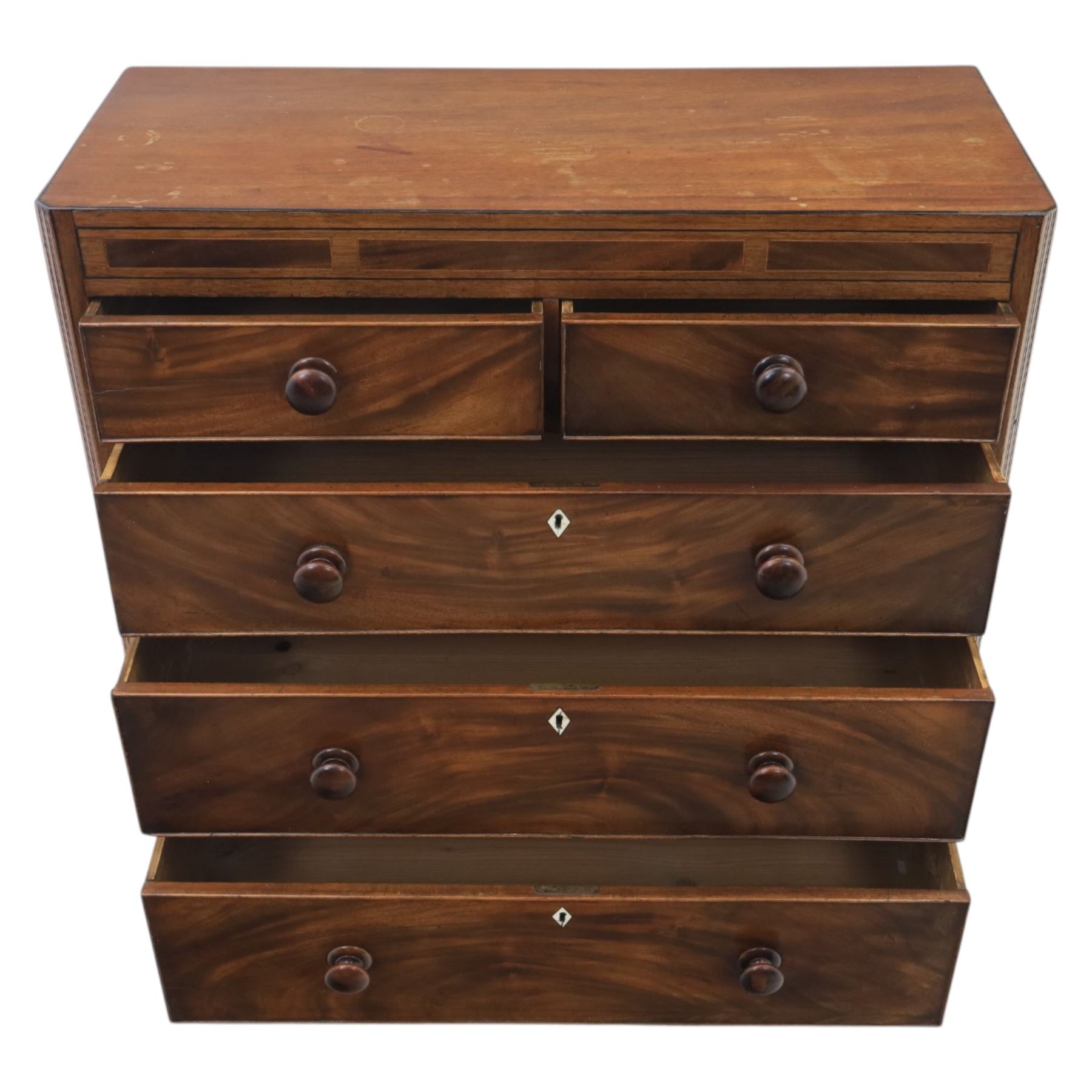 Early 19th century mahogany chest, straight front with canted corners, featuring inlaid detail above two short and three long drawers with flame veneered facias