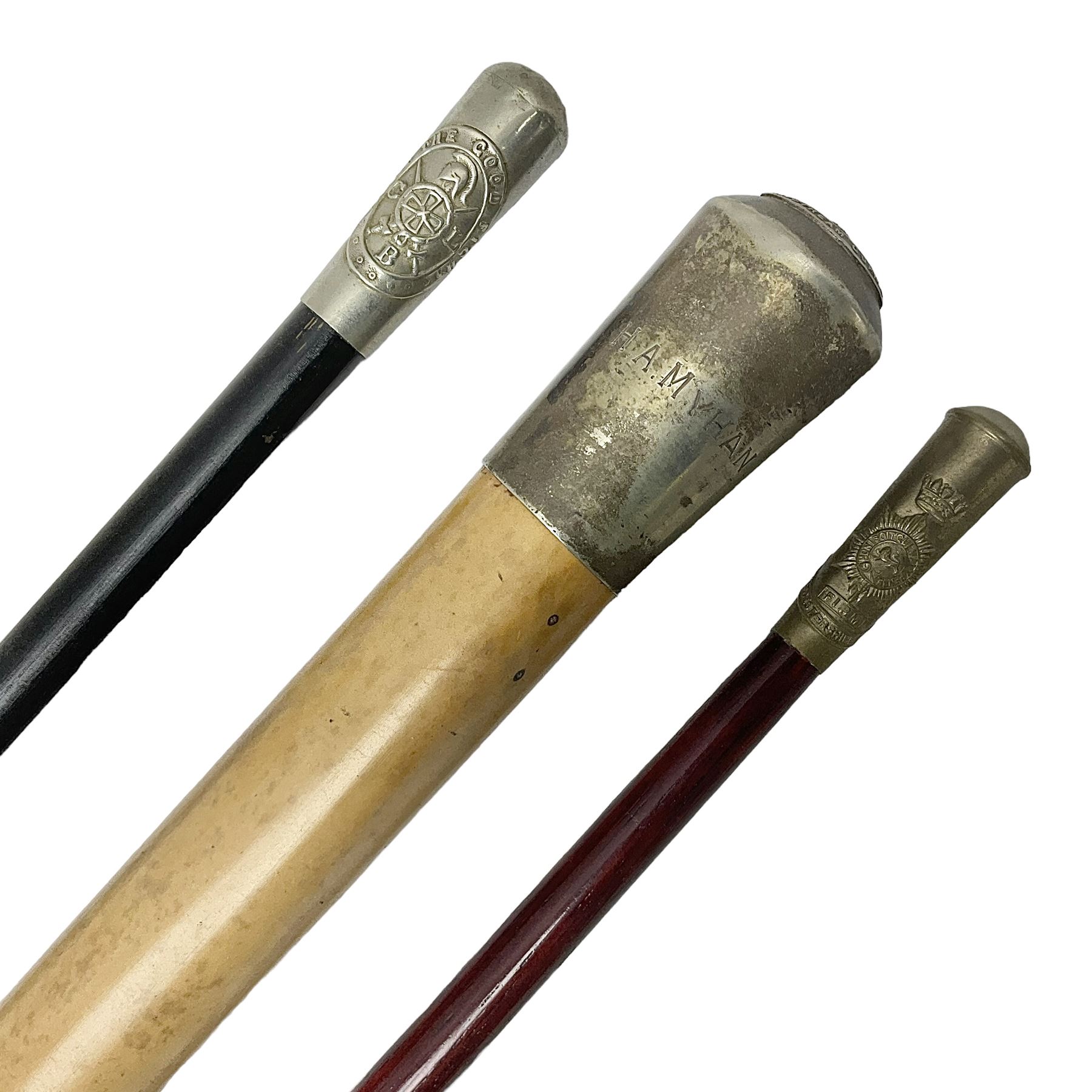 Three parade ground canes - malacca cane Coldstream Guards with plated mount engraved 'H.A. Myhan' L87cm; ebonised Church Lads Brigade 'Fight The Good Fight'; and mahogany stained Worcestershire Regiment (3)