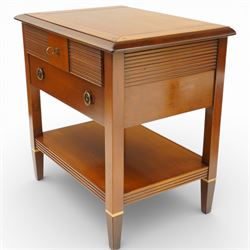 Brigitte Forestier - pair of cherry wood bedside cabinets, moulded rectangular top above two drawers, the top drawer with reeded panels flanking a brass circular pull, the lower drawer with two brass pulls, on square tapering supports united by a full length undertier