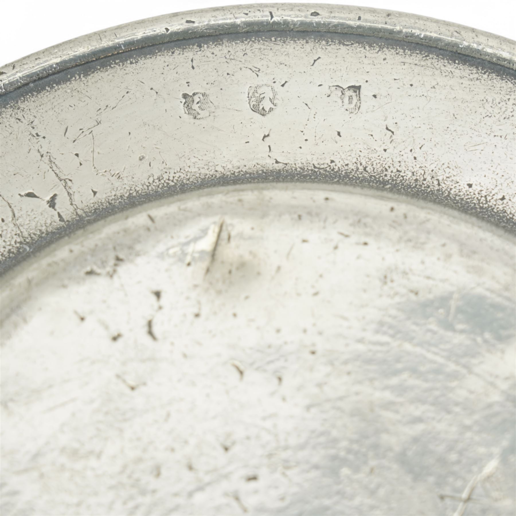 Collection of early 19th century and later British pewter, mostly London label marks, including two large pewter chargers, medicine spoon, flasks, plates and other tableware