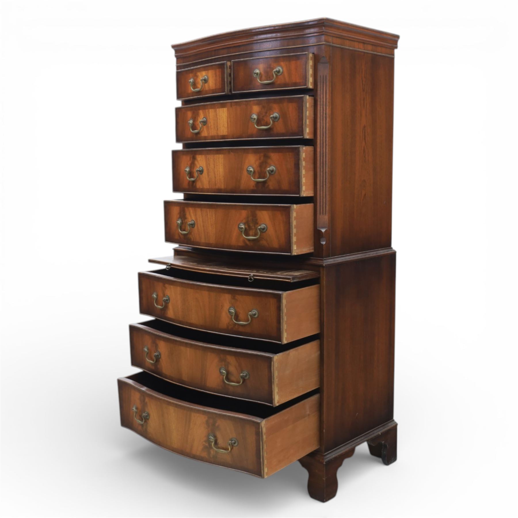 Reprodux - Georgian design mahogany serpentine chest-on-chest, top section with two over three drawer arrangement, flanked by chamfered edges, the lower fixed section, with slide above three drawers, raised on bracket feet  