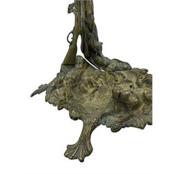 Pair of cast brass hallway umbrella or stick stands, in the form of a tree decorated with trailing flowering foliage branches, the stem with hunting horn over leaning shotgun, shaped naturalist tray base with hunting hound and out splayed foliate cast feet 