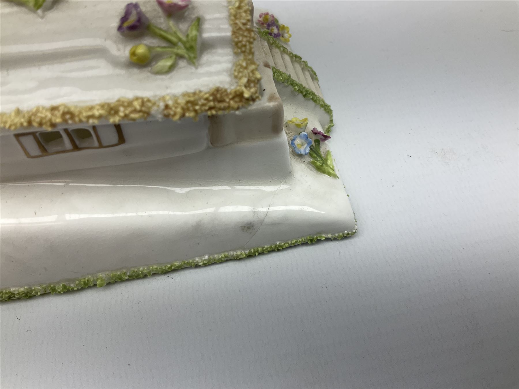 Group of figures, comprising six Royal Doulton examples, Daydreams HN1731, Silks and Ribbons HN2017, Tom Sawyer HN2926, Marie HN1370, Bo-Peep HN1811, and Tinkle Bell HN1677, together with a Dresden type 'lace' example, and a Coalport 'Swiss Cottage', (8)