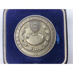 Charles I 1625 hammered silver sixpence, Queen Victoria 1894 crown coin and a cased hallmarked silver medal for the Hull photographic society, engraved '1940' 'Leonard Vokes', all housed in a red Pobjoy Mint coin box