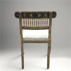 Early 20th century Anglo-Indian painted and inlaid armchairs, each with shaped top rail decorated with polychrome floral motifs above turned spindle galleries, shaped open arms and upholstered seats, on square supports with similar painted decoration