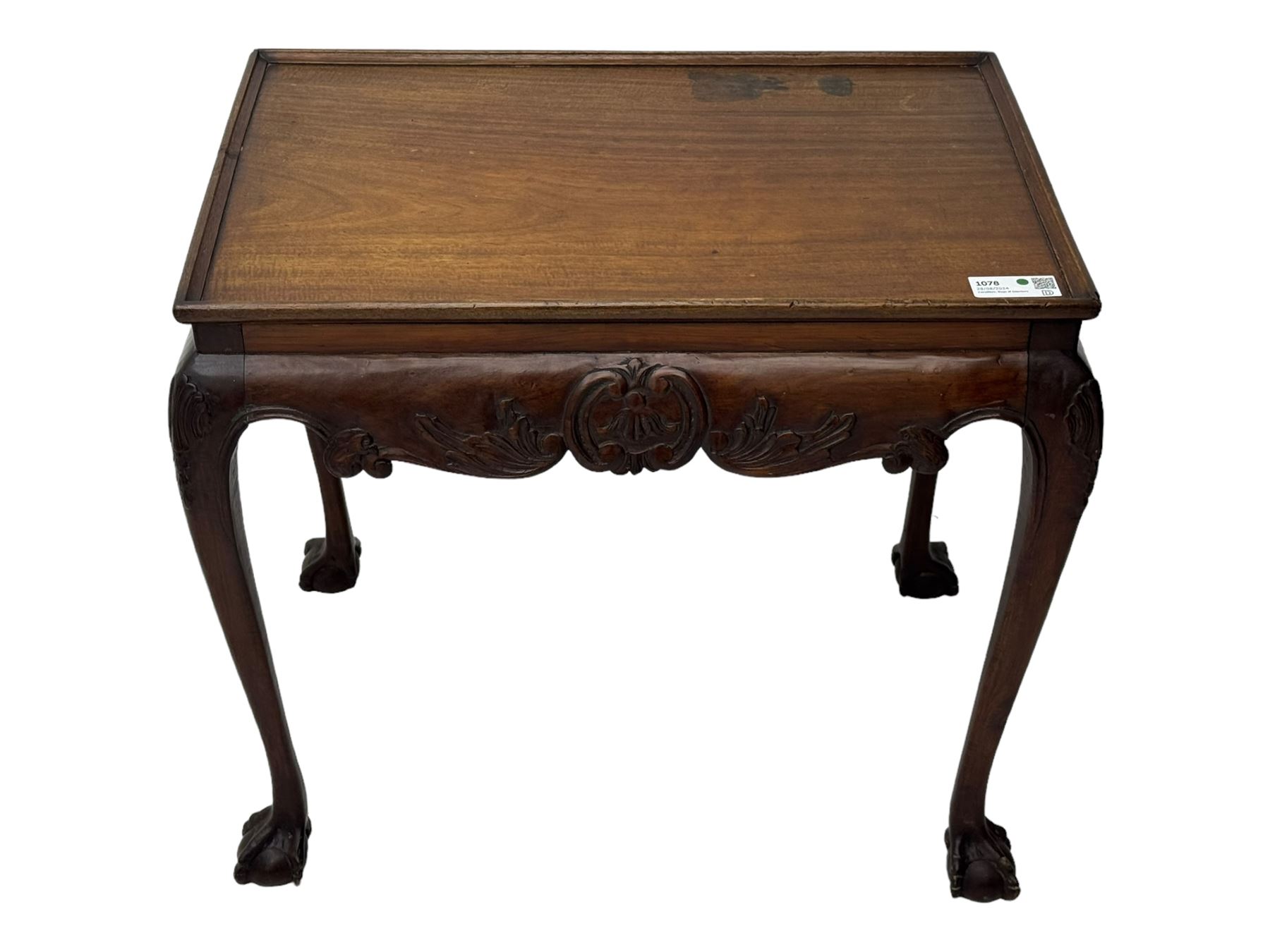 Late 19th to early 20th century mahogany side table, rectangular top with applied raised moulding, curved upper rails carved with C-scroll cartouches and extending curled leaves, bellflower carved cabriole supports with ball and claw feet 