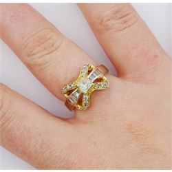 14ct gold diamond bow ring, the central princess cut diamond of approx 0.30 carat, with baguette and round brilliant cut diamond surround, stamped 585