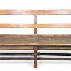 Early 20th century pine and oak bench seat, stained pine rail back frame with shaped oak arms