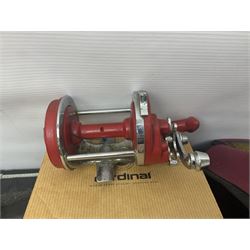 Collection of fishing memorabillia and equipment, including an Allcocks three piece split cane trout fly rod, Shakespeare Salt 3600 surf rod, two tackle bags, Old Red Seastreak multiplier reel, Sportext Saltwater fixed spool reel, fishing dvds, etc