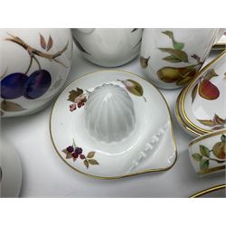 Royal Worcester Evesham pattern tea and dinner wares, to include, three covered tureens of various sizes, coffee pot, two lidded pots, tea cups and saucers of various sizes, two egg cups, round serving platter, five dinner plates, large jug, pair of napkin rings, salt and pepper etc (72)