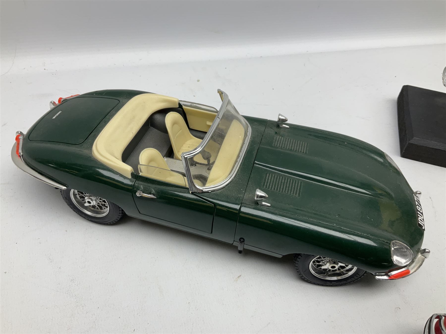 Three Franklin Mint die-cast models comprising 1935 Mercedes 500k Special Roadster, 1938 Jaguar SS-100 and 1907 Rolls Royce The Silver Ghost, together with Hof Bauer glass Lamborghini Countach
model and Bburago Jaguar 1961 'E' type