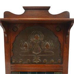 Shapland & Petter of Barnstaple - Arts & Crafts mahogany tile-backed umbrella or stick hall-stand, model no.114, the shaped back with single shelf over an Art Nouveau embossed patinated copper panel and turquoise tiled back, with turned supports and dividers over inset metal drip tray

Notes: A comparable Shapland & Petter stick stand of this model is recorded in Daryl Bennett, Shapland & Petter Ltd of Barnstaple, Museum of Barnstaple and North Devon, p.84, cat. no.5.37, and the model is also listed in Bennett, Liberty’s Furniture 1875-1915, p.298, cat. no.8.6. Examples of this model are known to have been retailed by Liberty & Co.