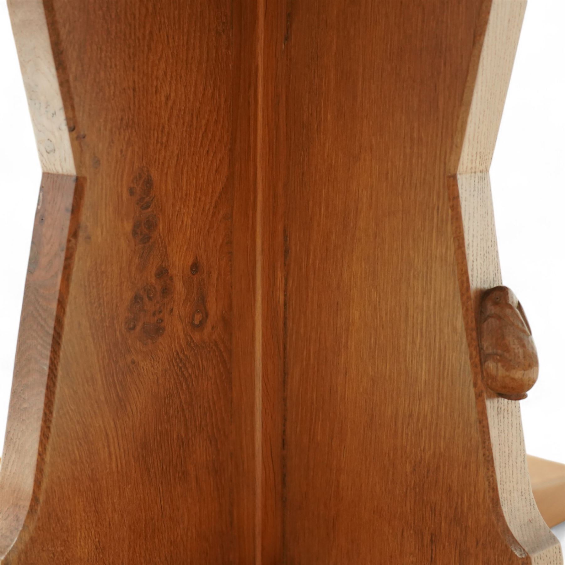 Rabbitman - circular oak dining table, adzed oak octagonal concave dining table, raised on a cruciform base, the supports and sledge feet also adzed, carved with rabbit signature, by Peter Heap of Wetwang