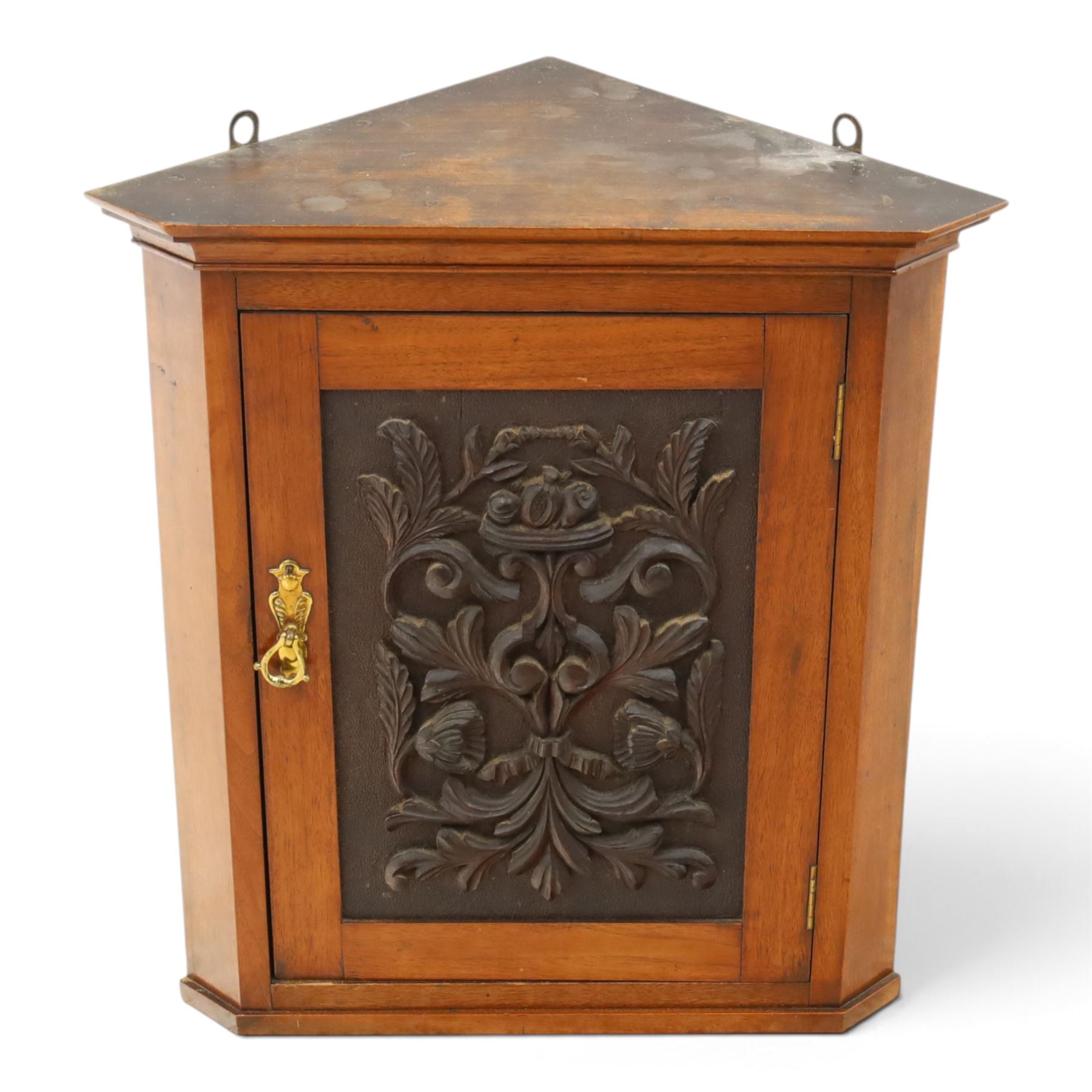 Edwardian walnut hanging corner cabinet, single panelled door with applied carved foliate decoration enclosing shelf 