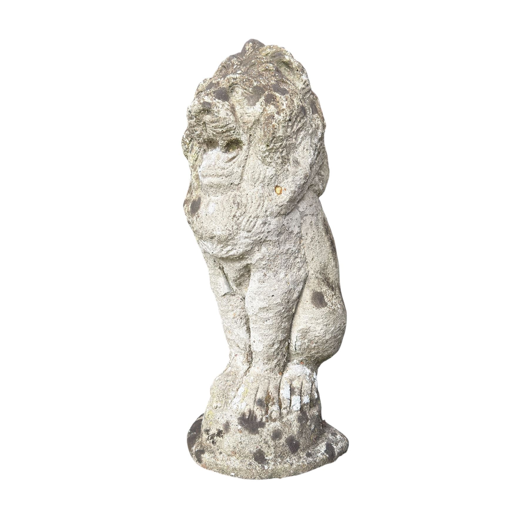 Four weathered cast stone lions in seated poses
