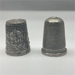 Egyptian silver lidded box, two continental silver thimbles and three others, cast metal hedgehog pin cushion and a rectangular trinket box