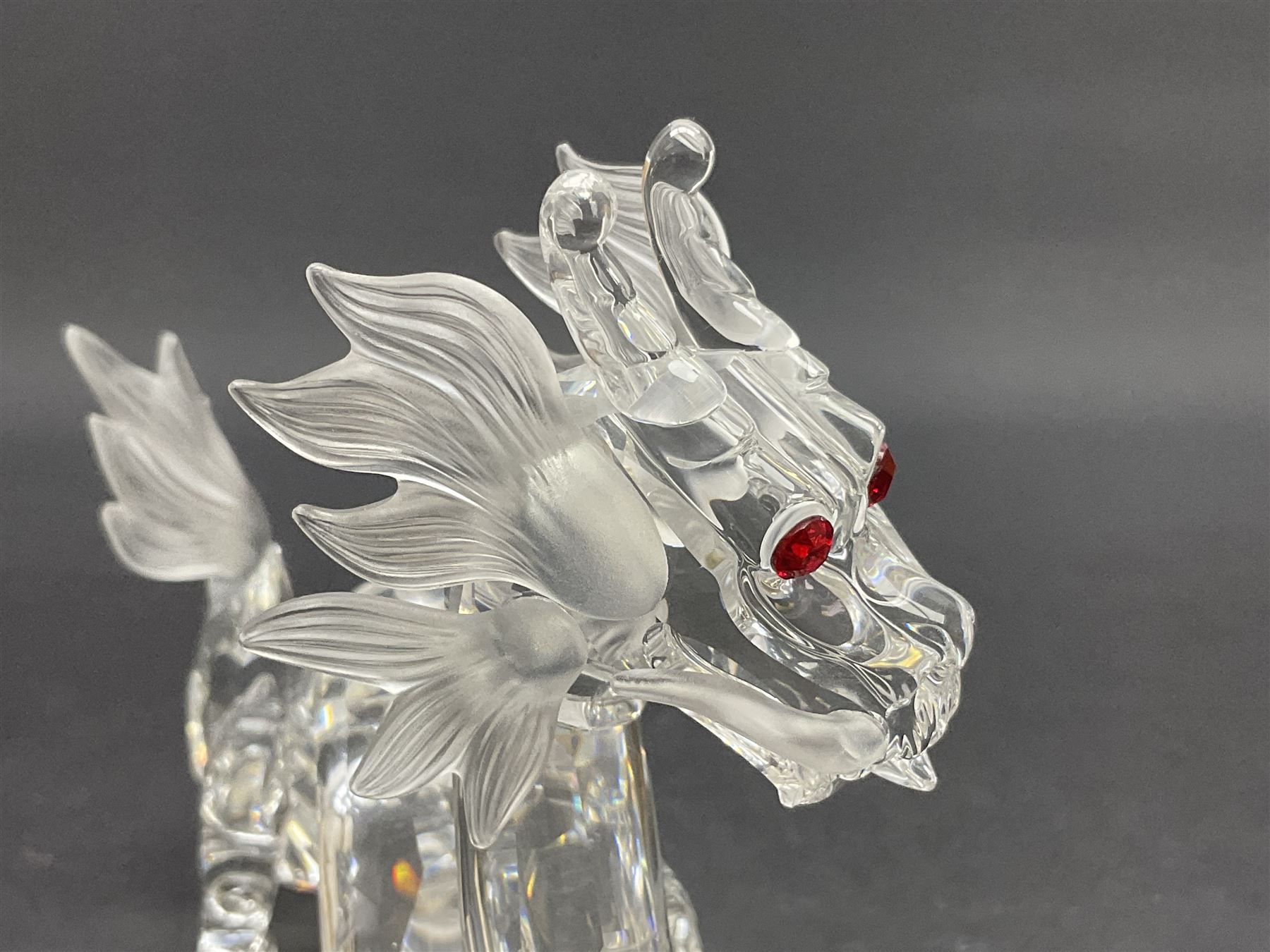 Two Swarovski Crystal Signs of the Zodiac figures, comprising horse and tiger, together with Zodiac dragon holding the flaming pearl, largest H11cm 