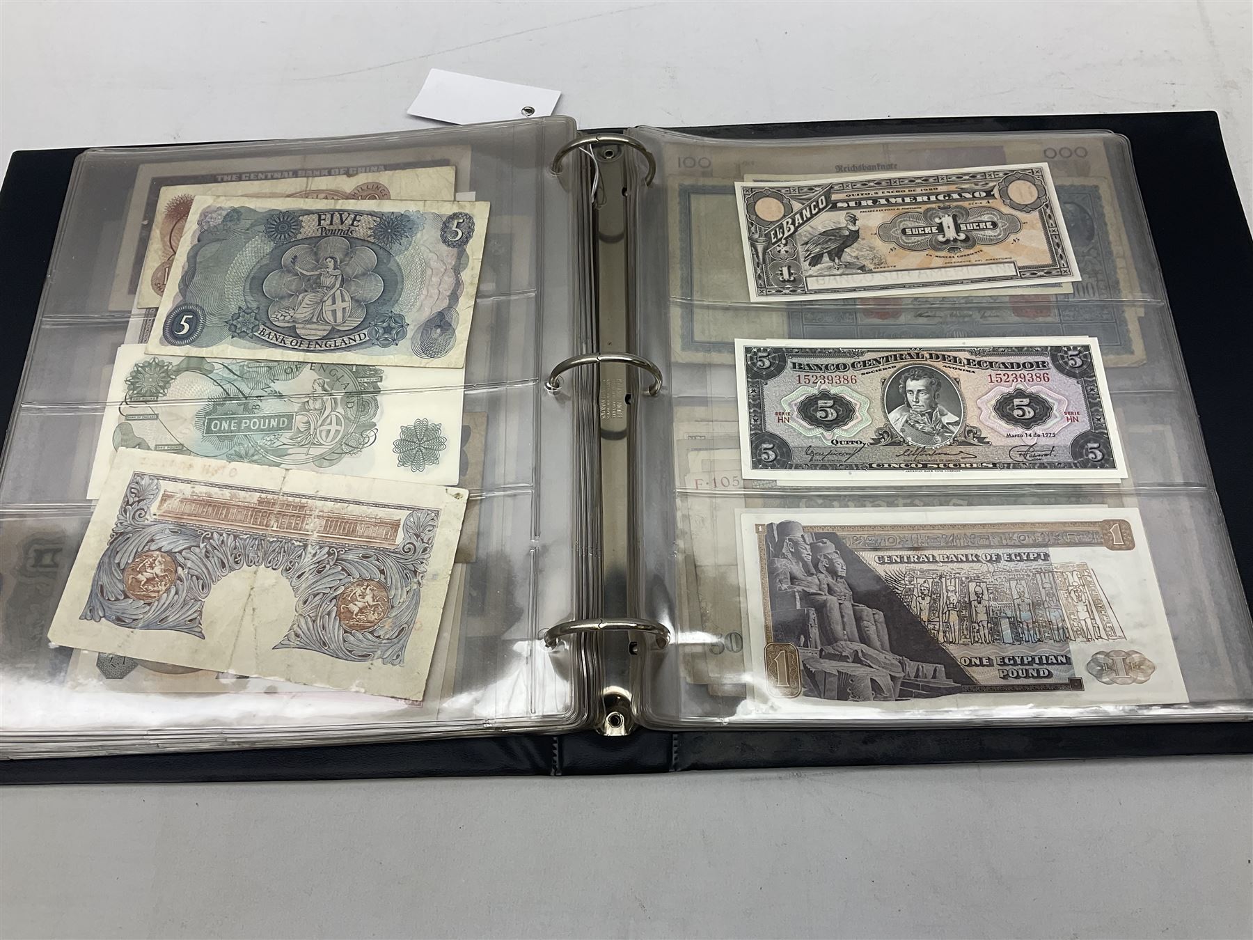 World banknotes, including Queen Elizabeth II The States of Jersey one pound 'DB202703', five pounds 'BB527762' and ten pounds 'AB651481', reserve bank of New Zealand two dollars '1L3 741894', King George V Straits Settlements one dollar 1st January 1935 'F/83 28924', various Bank of England notes etc, housed in two ring binder albums