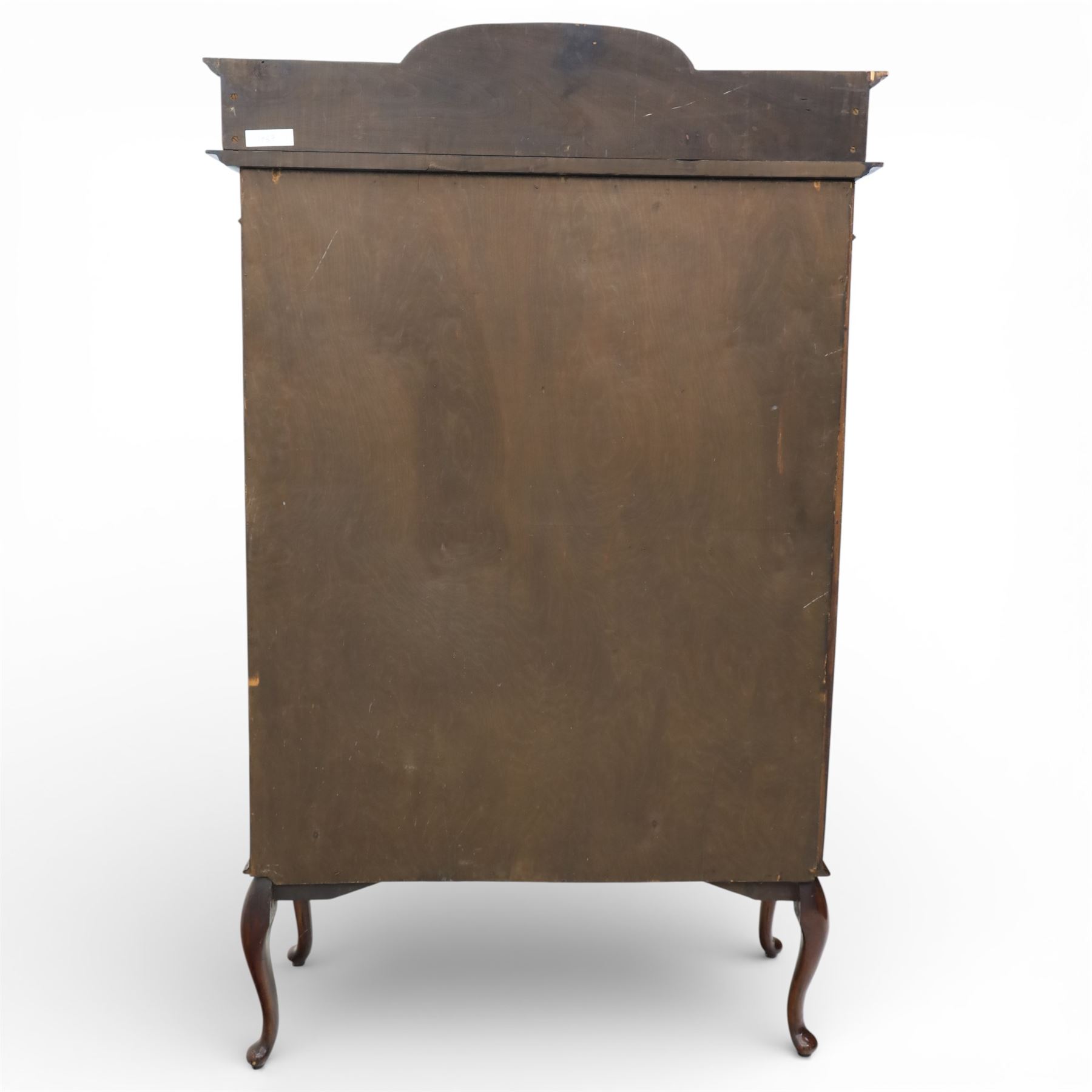 Edwardian mahogany display cabinet, arched back with satinwood and harewood marquetry foliate decoration above a moulded cornice, serpentine front fitted with twin glazed doors with astragal bars, the lower door panels inlaid with oval reserves, standing on elegant cabriole legs terminating in pad feet