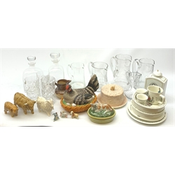 A selection of ceramics and glassware, to include a Victorian pottery butter dish, the lid moulded in the form of a cow, a Sylvac cheese dome with mouse finial, a salt glazed jug, three Scotia figurines, two modelled as cows, the other as a goat, a Copenhagen decanter transfer decorated with a portrait of Sophus Berendsen, eight pieces of Wedwood Peter Rabbit pattern, plus a selection of various glassware, to include two Dartington clear glass decanters, and a number of lemonade jugs. 