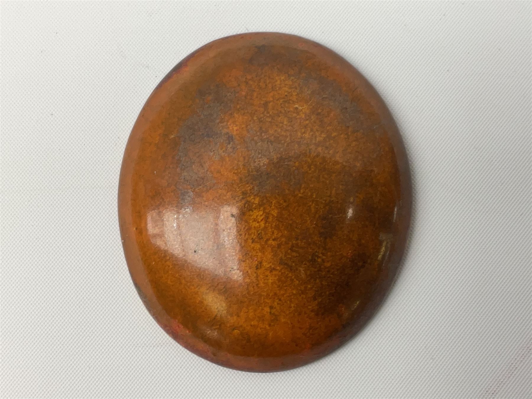 Henry George Murphy (1884-1939), collection of seven Arts & Crafts glazed ceramic roundels, of circular and oval form, five in tones of red and brown and two in tones of blue, turquoise and green in soufflé and high fired finishes, largest example D6.5cm