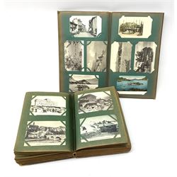 Two early 20th century albums containing over five-hundred and fifty Edwardian and later postcards including real photographic and printed British and continental topographical, shipping, interior scenes etc (2)