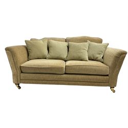 Two seater sofa, upholstered in cream fabric 