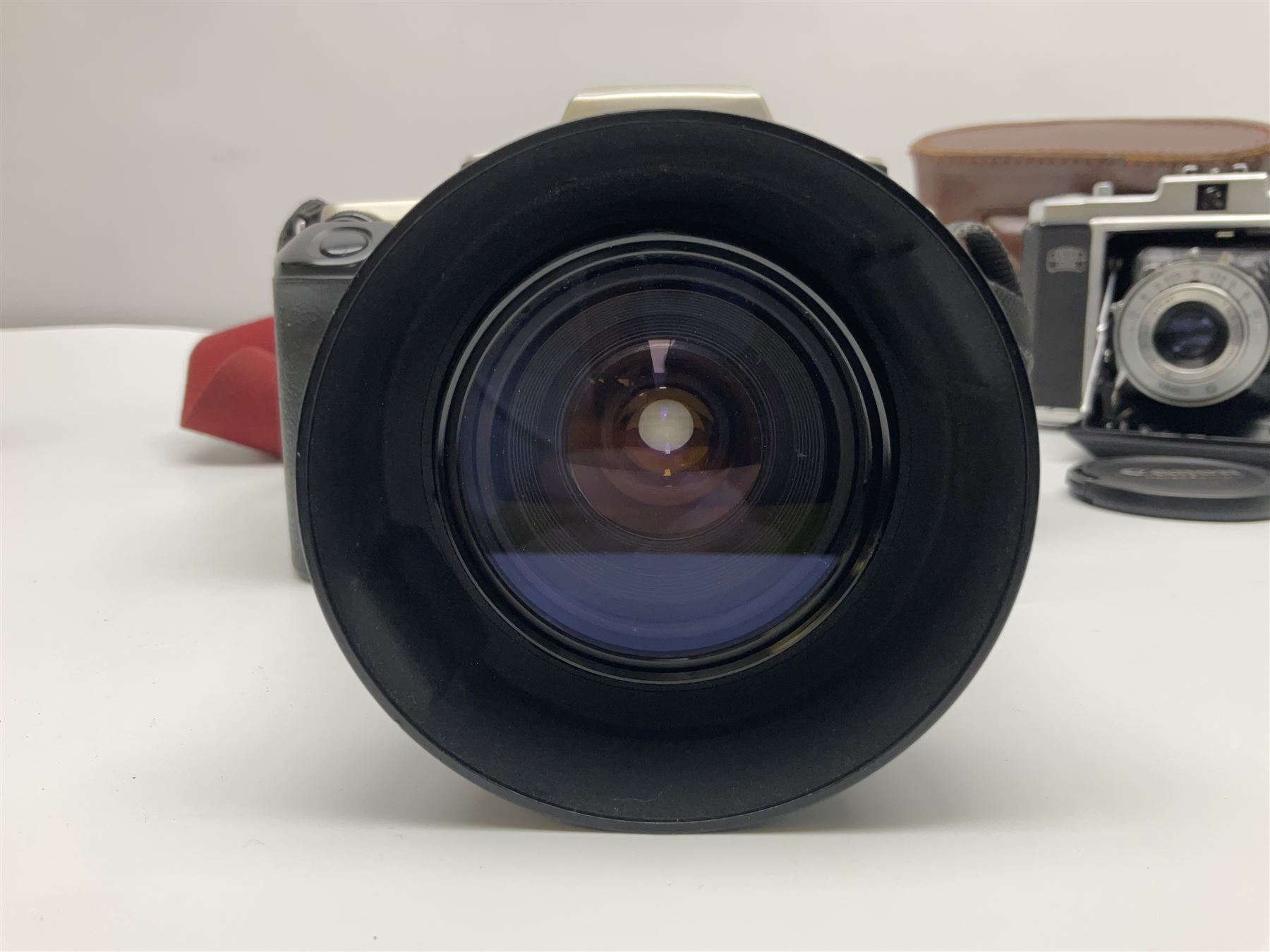 Canon EOS 50e camera body, serial no 8305671 with 'Canon Zoom EF 35-135mm 1:4-5.6' lens together with Halina 35X super camera body, with 'Halina Anastigmat f.c. 1:3.5 f=45mm' lens and other camera equipment 