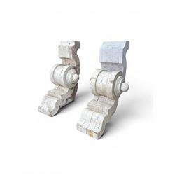 Pair of 19th century stripped pine columns  with carved capitols; an a pair of painted scroll architectural capitols (4)