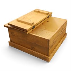 Indigo Furniture - rustic oak coffee table with double-hinged top concealing compartment, on skirted base