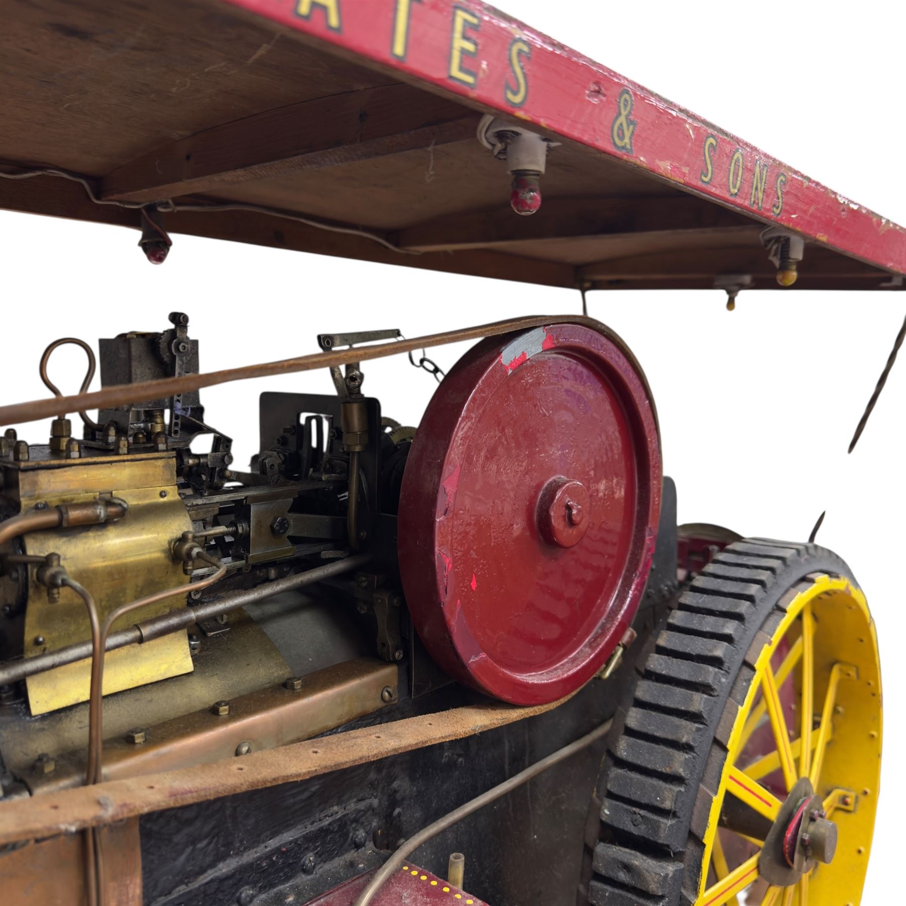 Mid-20th century scratch-built red and yellow painted live-steam scale model of a Showman's Traction Engine, 'Supreme' S.A. Oates & Sons, the simulated full length planked wooden canopy with brass supports and rope edging, with regulator, hand brake, chain steering , dynamo and water feed controls 19cm flywheel, 32cm diameter rear wheels with solid rubber tyres and 21cm diameter front wheels L102cm; together with scratch-built ride-on two-wheel trailer L58cm, and various brass rally plaques for 1980s/1990s.
This is a large, most interesting and comprehensive live-steam working model in need of re-furnishment and some repairs, the boiler has not been tested.