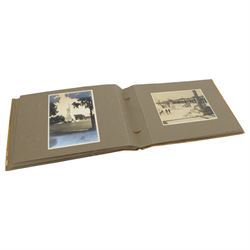 Early 20th century photograph album, documenting the travels of RMS Alcantara, with painting to front cover and containing black and white photographs