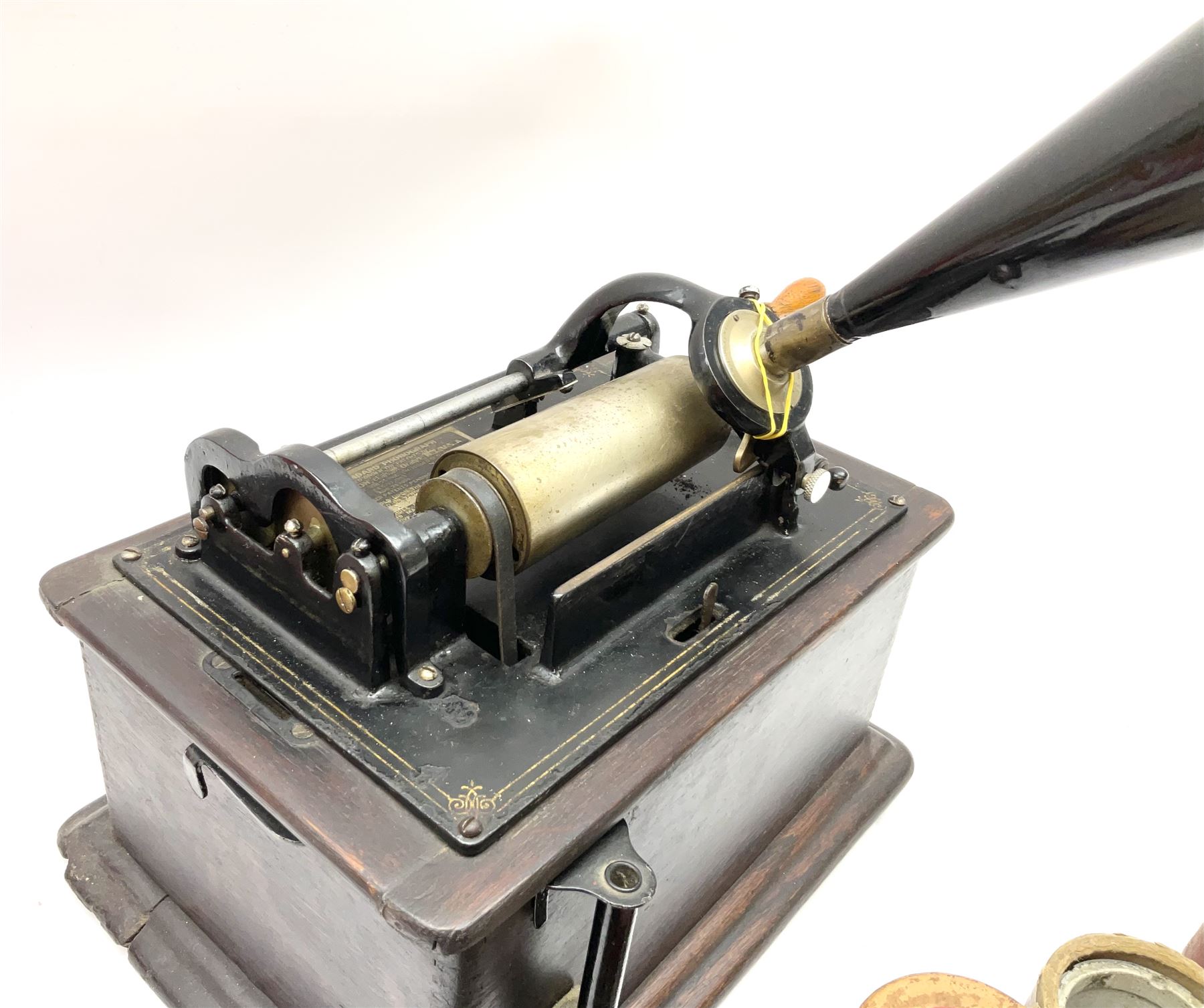Edison Standard Phonograph with oak base (no cover), the reproducer marked 'Model C', serial no. 634857, last patent date Oct.1905, with black japanned conical horn L33cm; together with five cylinders