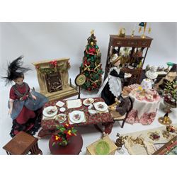 Dolls house living room and dining room furniture, including arm chairs, desk, fireplaces, dressers, tables, eight figures and a large collection of predominantly Christmas themed food, accessories and decorations