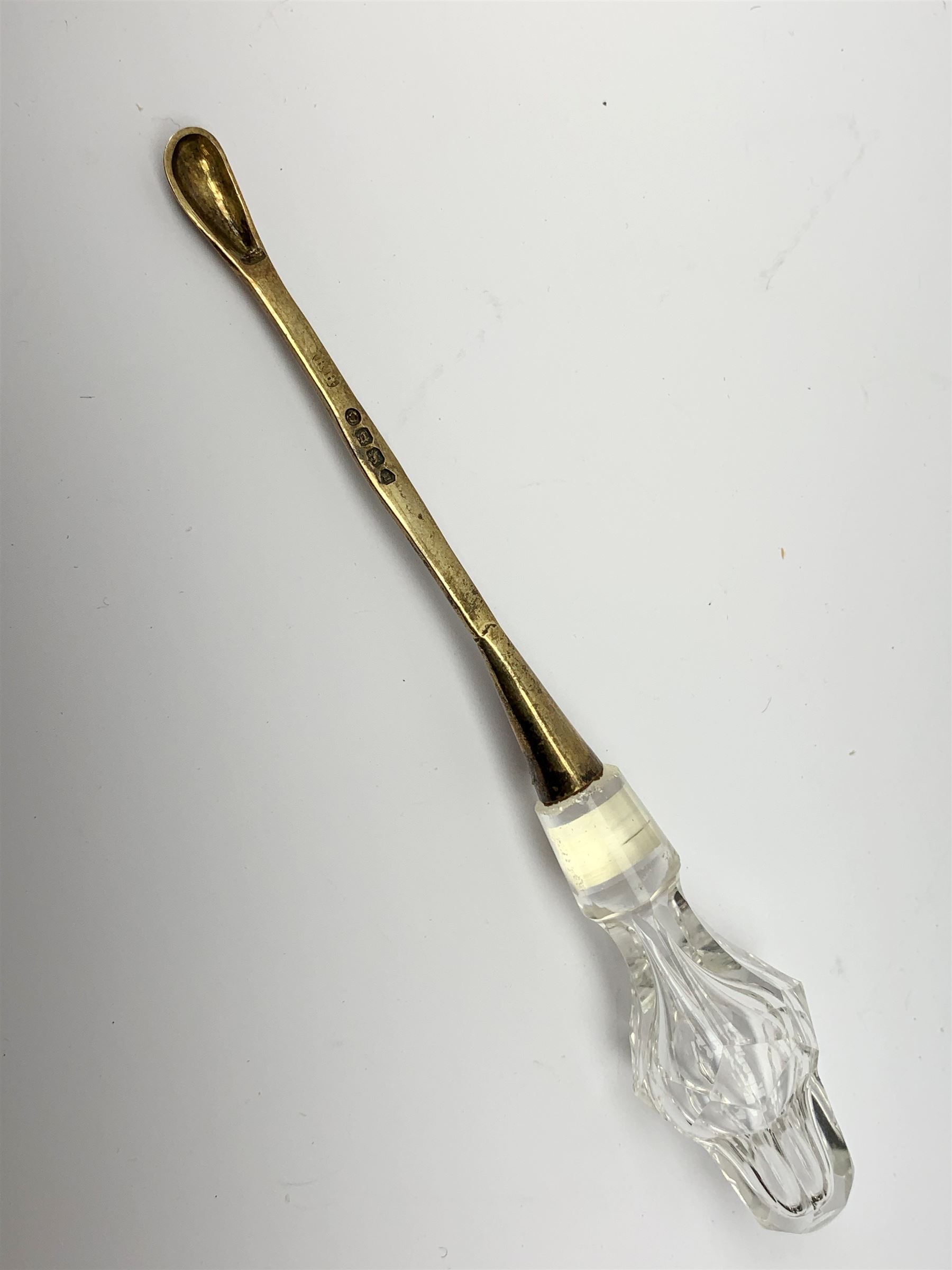 A group of Victorian glass condiment bottles, to include a set of four bottles and jar with cut decoration, one bottle with pierced silver domed top, another bottle with silver gilt spoon top, and jar with silver domed hinged cover, all hallmarked Robert Harper, London 1868. (8). 